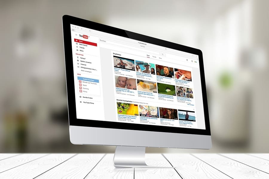 a desktop computer showing YouTube